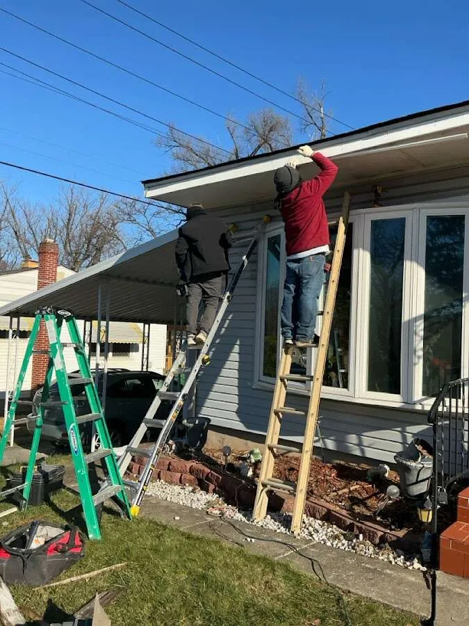 Restoration crew performing exterior repair in Helotes